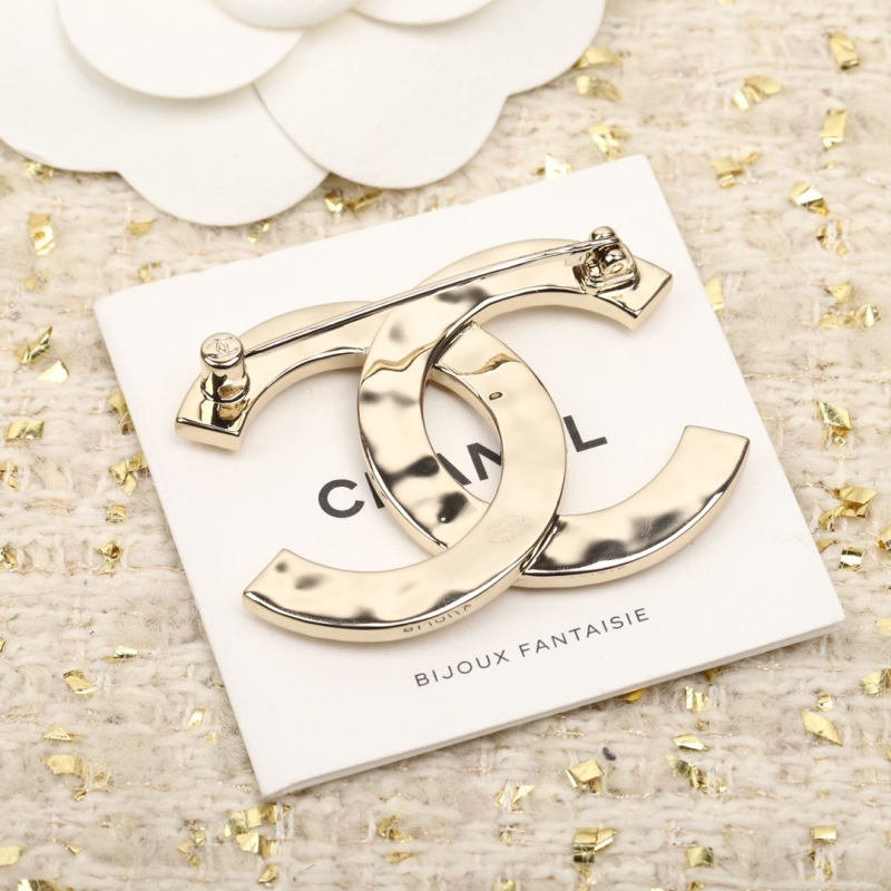 Ch**el brooches